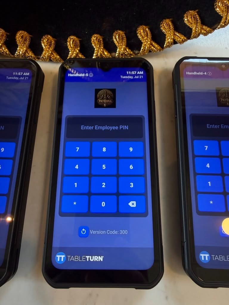 TableTurn handheld devices in use at a restaurant counter